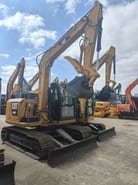 Caterpillar 308E crawler excavator, front three-quarter view