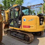 2022 Caterpillar 307E2 excavator, rear three-quarter view
