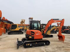 2022 Kubota KX057-4 mini excavator, front three-quarter view