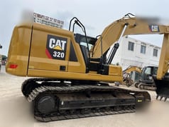 2018 Caterpillar 320 crawler excavator, side view