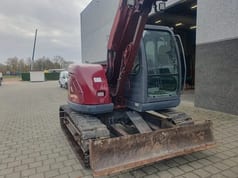2005 New Holland E70 mini excavator, front three-quarter view