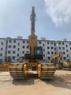 2020 Caterpillar 320D crawler excavator, front view with swamp buggy tracks