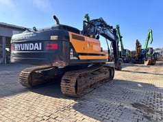 2022 Hyundai HX300ANL crawler excavator, rear three-quarter view