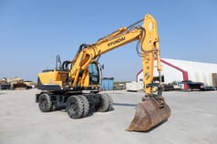 2015 Hyundai R140W-9A wheel excavator, side profile view