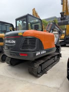 2026 Develon DX60D-10 crawler excavator, rear three-quarter view