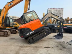 2025 Doosan DX60D-10 crawler excavator, rear three-quarter view
