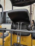 2026 XCMG XE17U Mini Excavator with a close-up view of the black operator seat and controls.