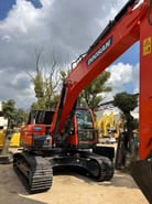 2022 Doosan DX225LC-9C excavator, front three-quarter view