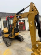 2023 Caterpillar 303CR mini excavator, front three-quarter view