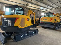2025 XCMG XE75GA Mini Excavator with a black dozer blade and visible model markings on the counterweight.
