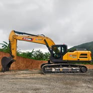 2026 XCMG XE335G Crawler Excavator with its full boom and arm extended forward, showing the digging bucket.