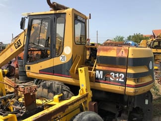 1999 Caterpillar M312 Kotač Bager