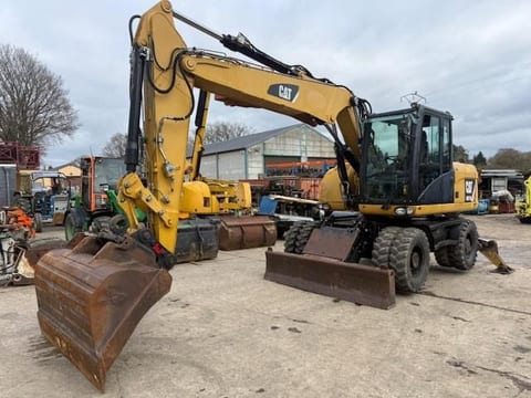 2010 Caterpillar M313D wheel excavator, front three-quarter view