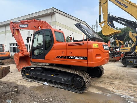 2023 Doosan DX225LC crawler excavator, rear three-quarter view