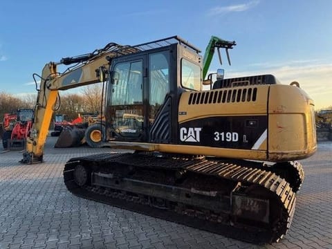 2010 Caterpillar 319DL crawler excavator, side view