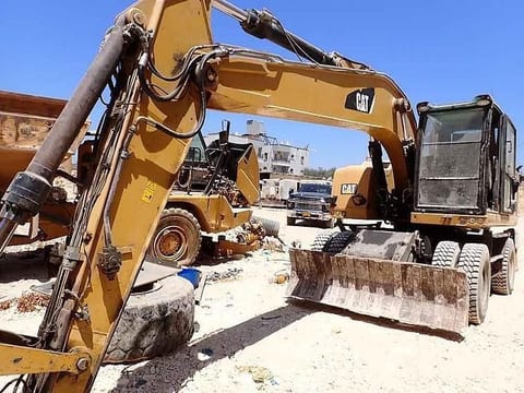 2016 Caterpillar M320F wheel excavator, front three-quarter view