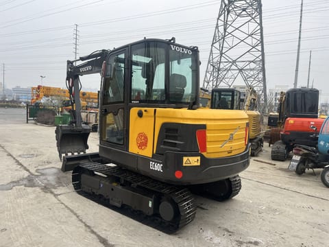 2023 Volvo EC60C mini excavator, rear three-quarter view