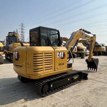 2023 Caterpillar 305.5E mini excavator, rear three-quarter view