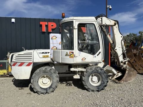 2005 Mecalac 12MXT wheel excavator side view