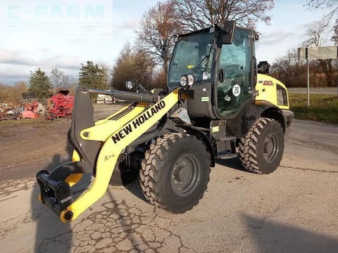 2023 New Holland W80C mini excavator, front three-quarter view 2023 New Holland W80C mini excavator, front three-quarter view