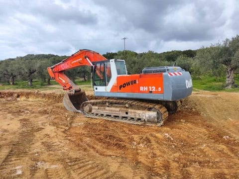2002 O&K RH 12.5 crawler excavator, rear three-quarter view
