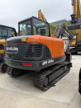 2026 Develon DX60D-10 crawler excavator, rear three-quarter view